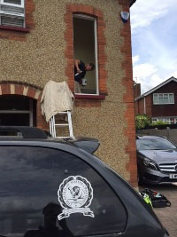 London and Herts Sash window craftsmen at work renovating the timber window