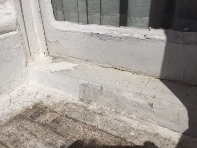 Origianal bay sash window showing signs of rot