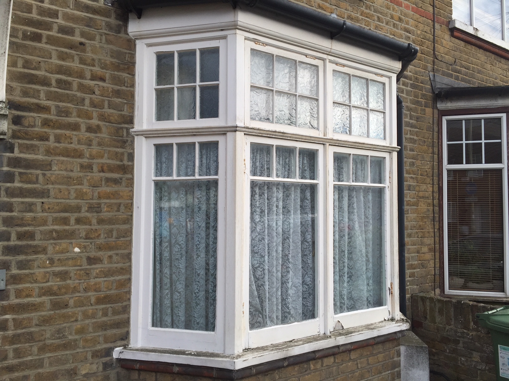 Old single glazed windows with rotting timber frames - before the restoration service provided by London & Herts Sash Windows